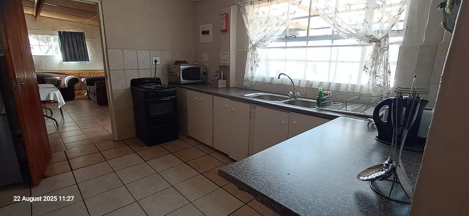 Kitchen or kitchenette, microwave, oven, stove