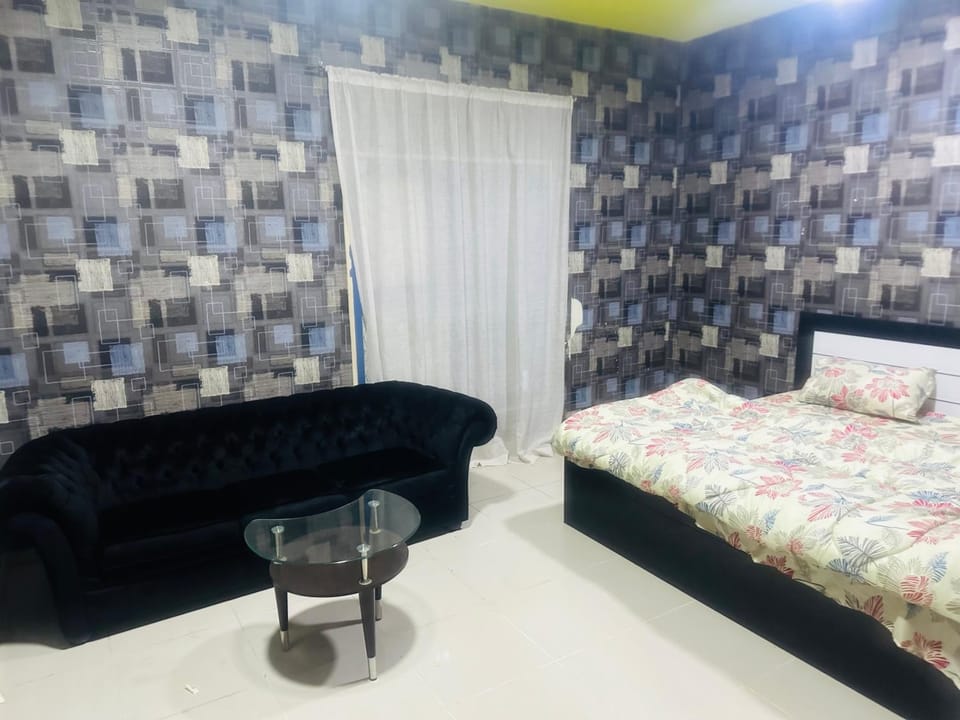 Bed, Living room, Seating area, Bedroom