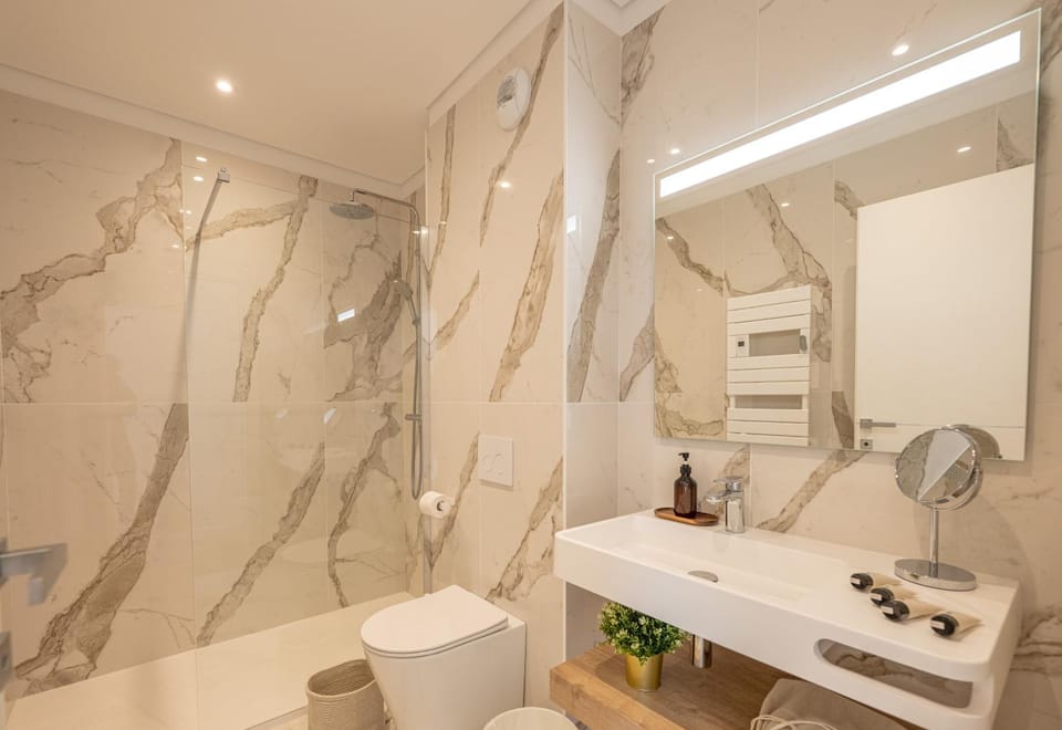 Shower, Toilet, Bathroom, hair dryier, towels