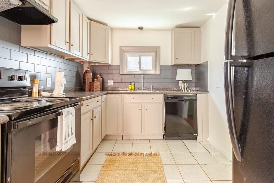 Kitchen or kitchenette, dishwasher, oven, stove