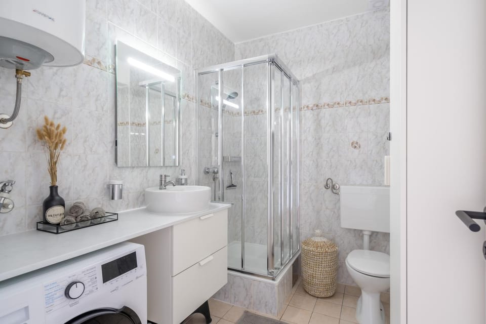 Shower, Toilet, Bathroom, towels, washing machine, dryer