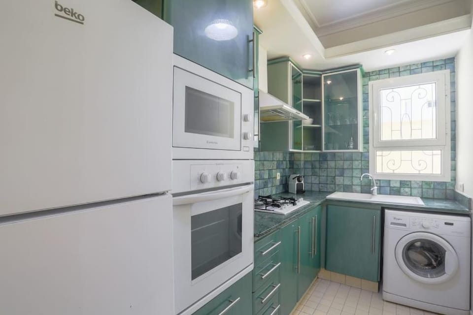 Kitchen or kitchenette, stove, washing machine