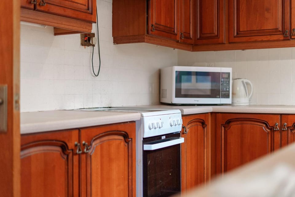 Kitchen or kitchenette, oven, stove, toaster