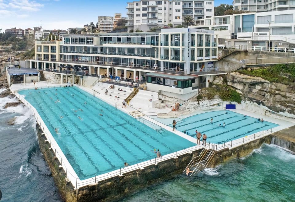 Property building, Nearby landmark, Day, People, Natural landscape, Beach, Pool view, Sea view, Swimming pool, group of guests, sunbed
