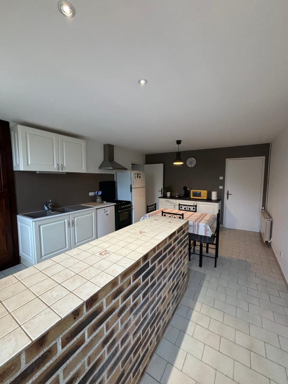 Kitchen or kitchenette, dishwasher, oven, stove