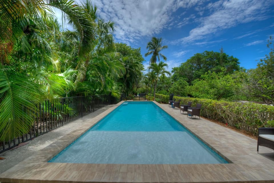 Waterfront Pink House with Private Dock & Pool House in Sanibel Island