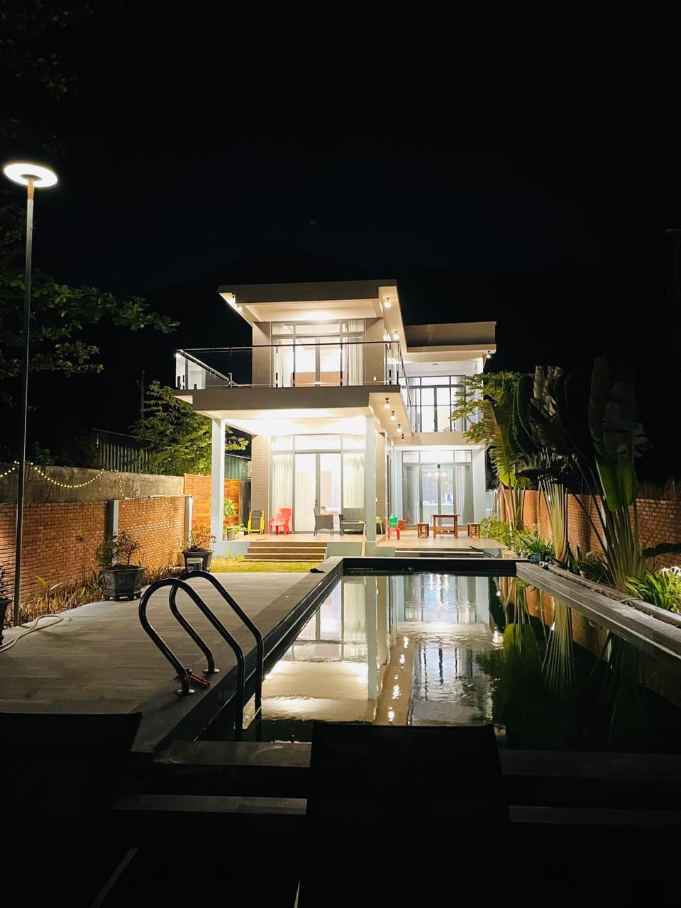Property building, Patio, Night, Swimming pool
