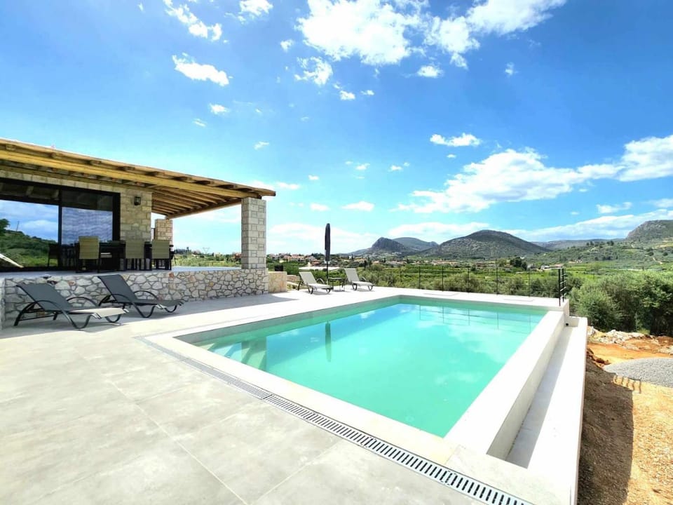 Patio, Day, Natural landscape, Mountain view, Swimming pool, sunbed