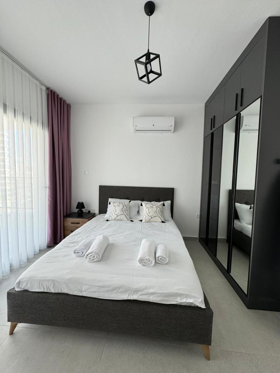 Bedroom, towels, wardrobe, air conditioner