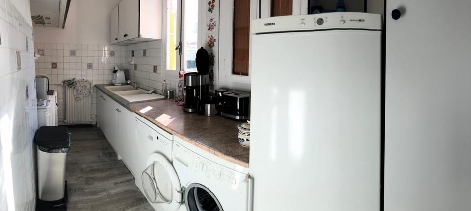Kitchen or kitchenette, dishwasher, oven, stove, washing machine