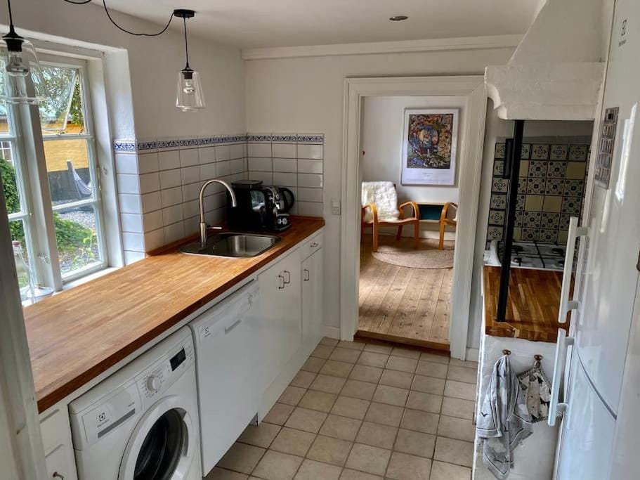 Kitchen or kitchenette, dishwasher, stove, washing machine
