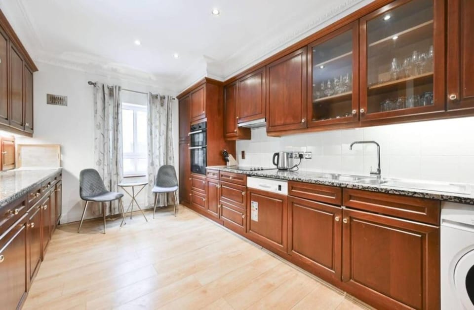 Kitchen or kitchenette, dishwasher, oven, stove, toaster, washing machine