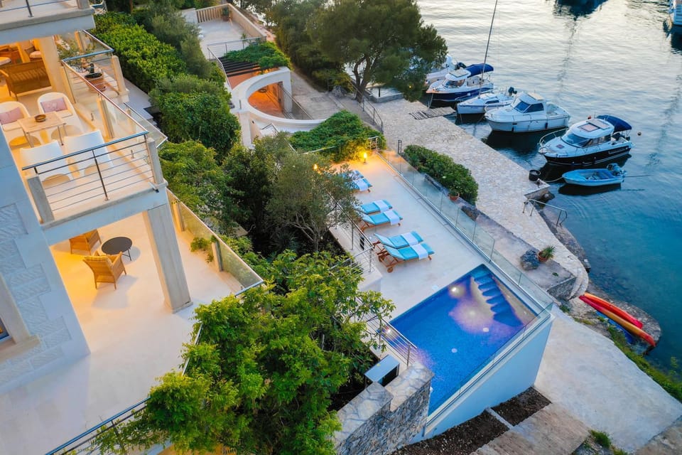 VILLA PHILIPPA - luxurious five-room villa - idyllic location - first row to the sea - spectacular view of the sea bay - unforgettable sunsets - 15 minutes from Supetar ferry port - free parking - private heated pool Villa in Split-Dalmatia County