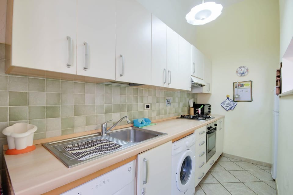 Kitchen or kitchenette, dishwasher, oven, stove, washing machine