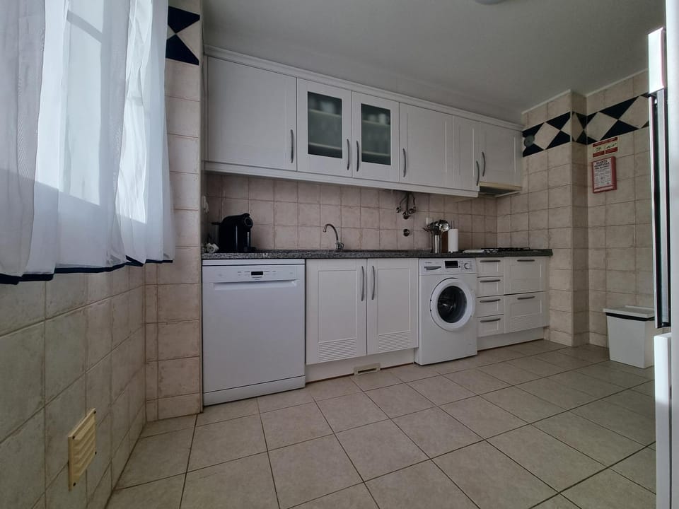 Kitchen or kitchenette, dishwasher, stove, washing machine