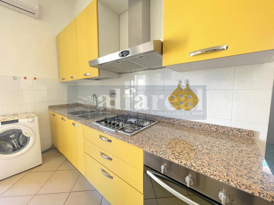 Kitchen or kitchenette, washing machine