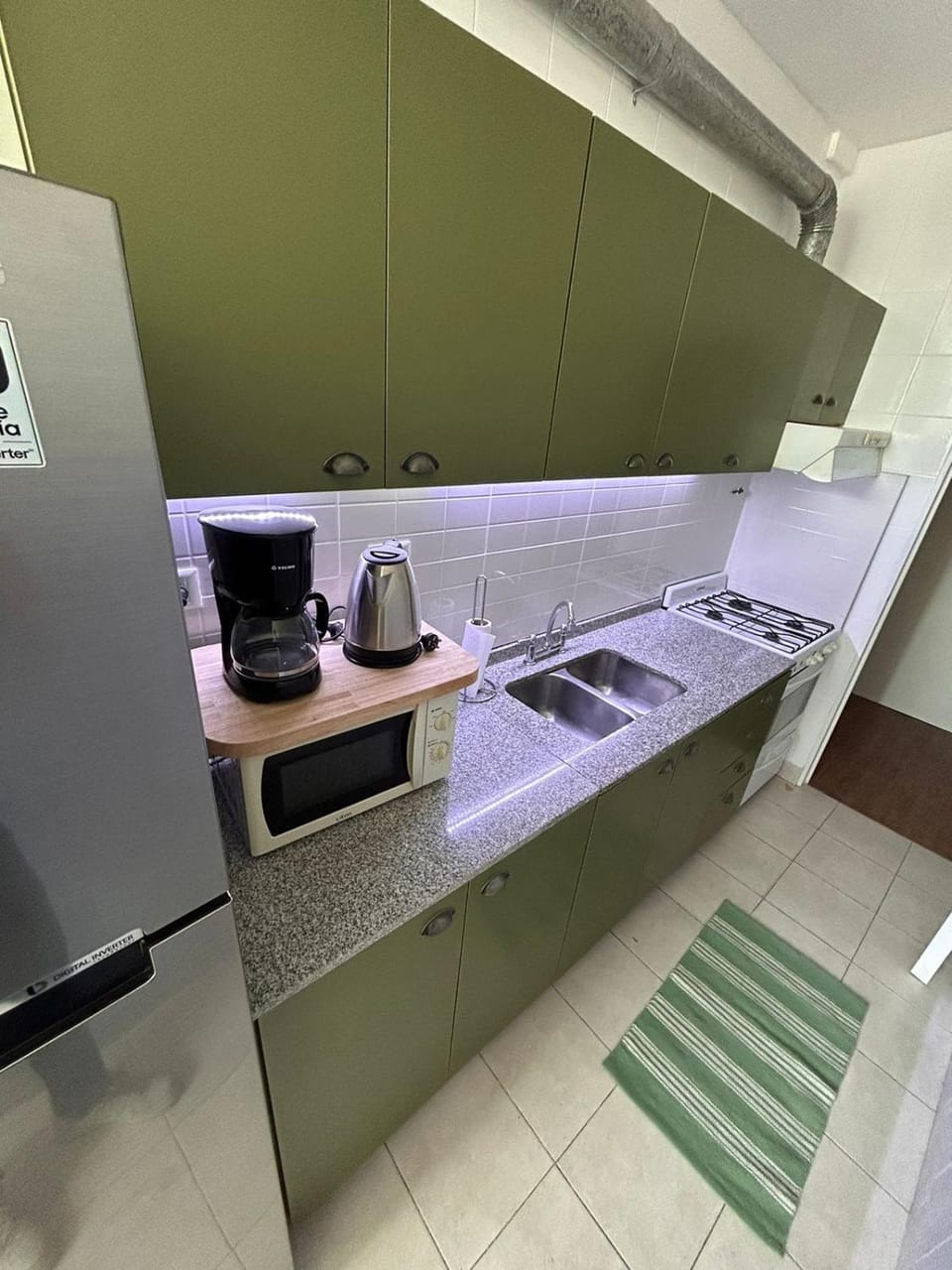 Kitchen or kitchenette, microwave, oven, stove, toaster