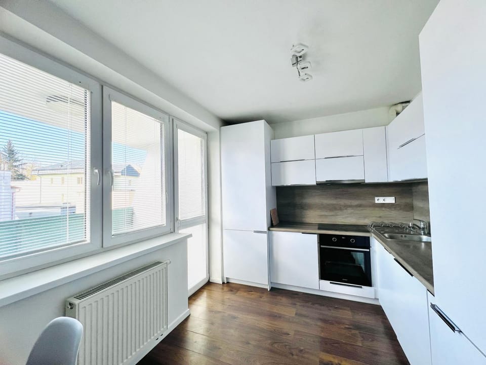Kitchen or kitchenette, dishwasher, microwave, oven, stove