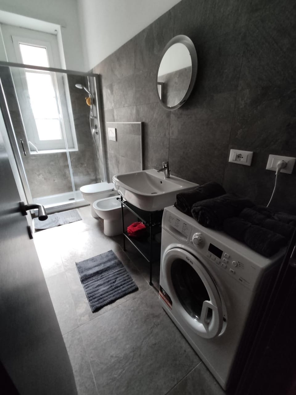 Shower, Bathroom, Photo of the whole room, hair dryier, towels, laundry, washing machine, dryer