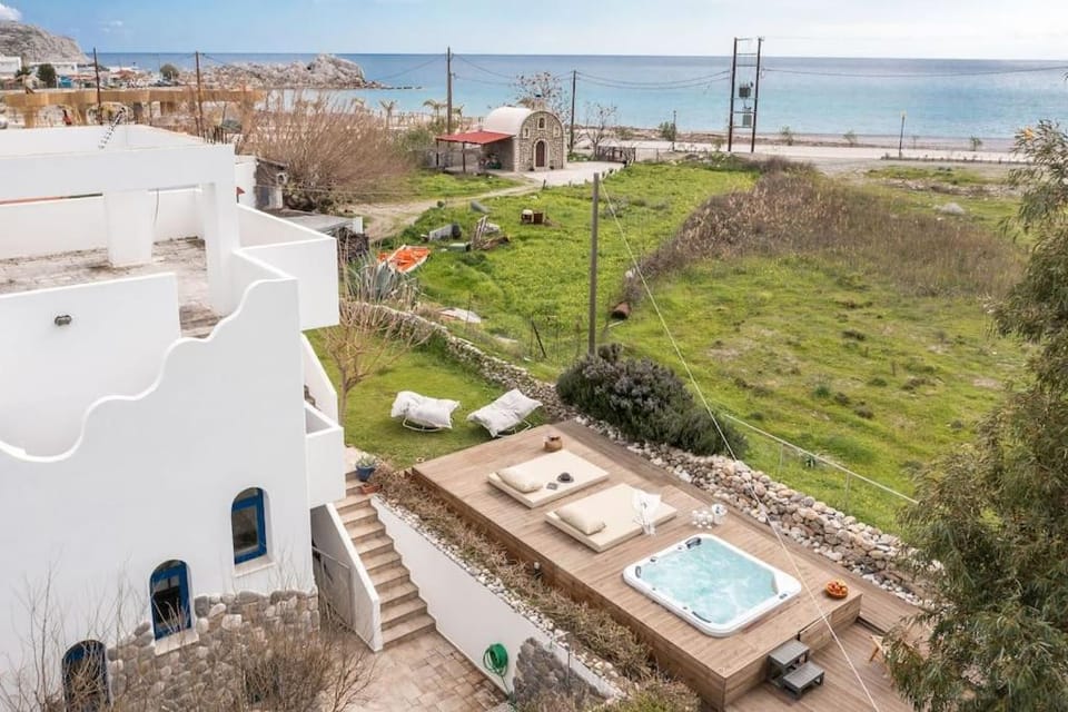 Property building, Nearby landmark, Natural landscape, Bird's eye view, Garden, Beach, Garden view, Sea view, sunbed