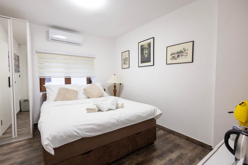 Bed, Photo of the whole room, Bedroom, towels, air conditioner
