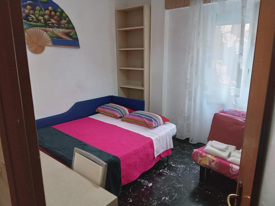 Bed, towels, wardrobe