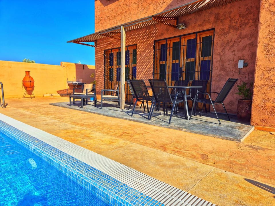 Property building, Patio, Day, BBQ facilities, Pool view, Swimming pool