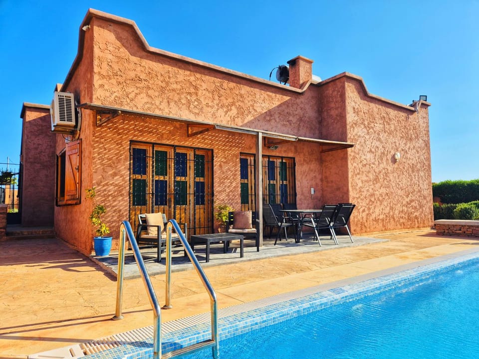 Property building, Patio, Day, Pool view, Swimming pool