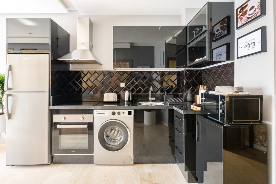 Kitchen or kitchenette, oven, stove, toaster, washing machine, dryer