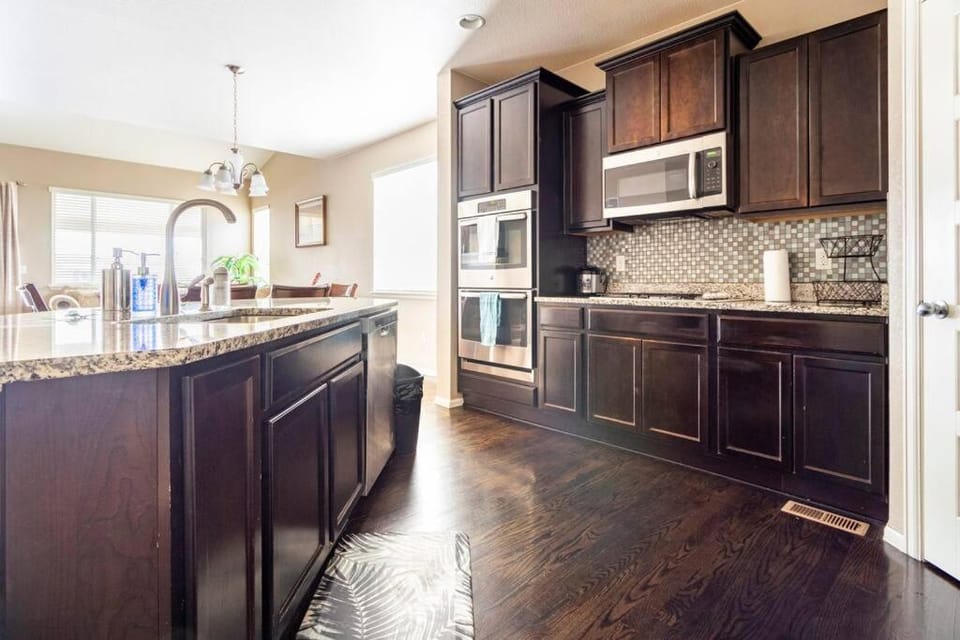 Kitchen or kitchenette, dishwasher, oven, stove