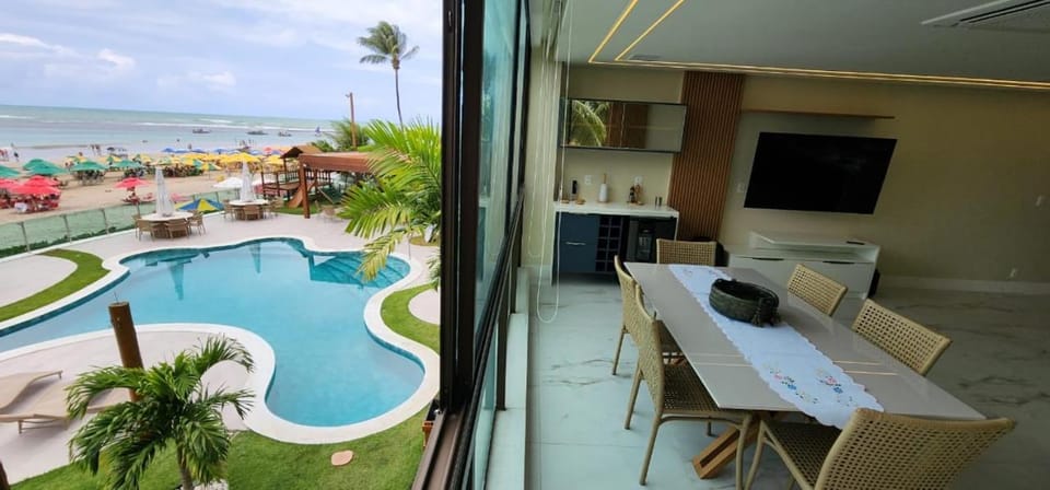 View (from property/room), Dining area, Beach, Swimming pool
