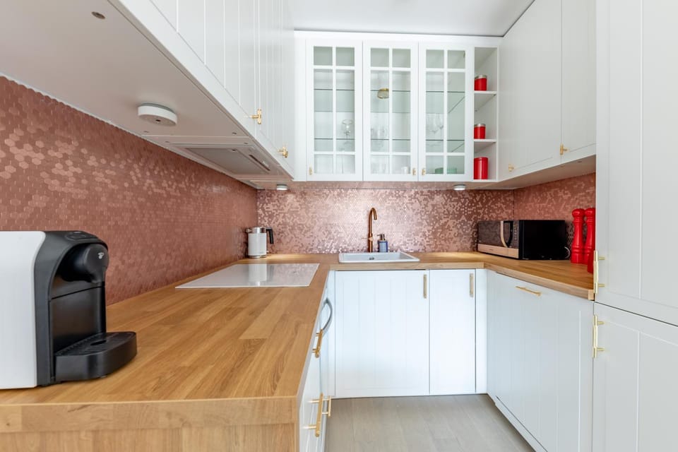 Kitchen or kitchenette, dishwasher, oven, stove