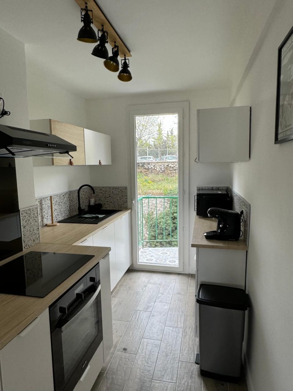 Kitchen or kitchenette, dishwasher, oven, stove