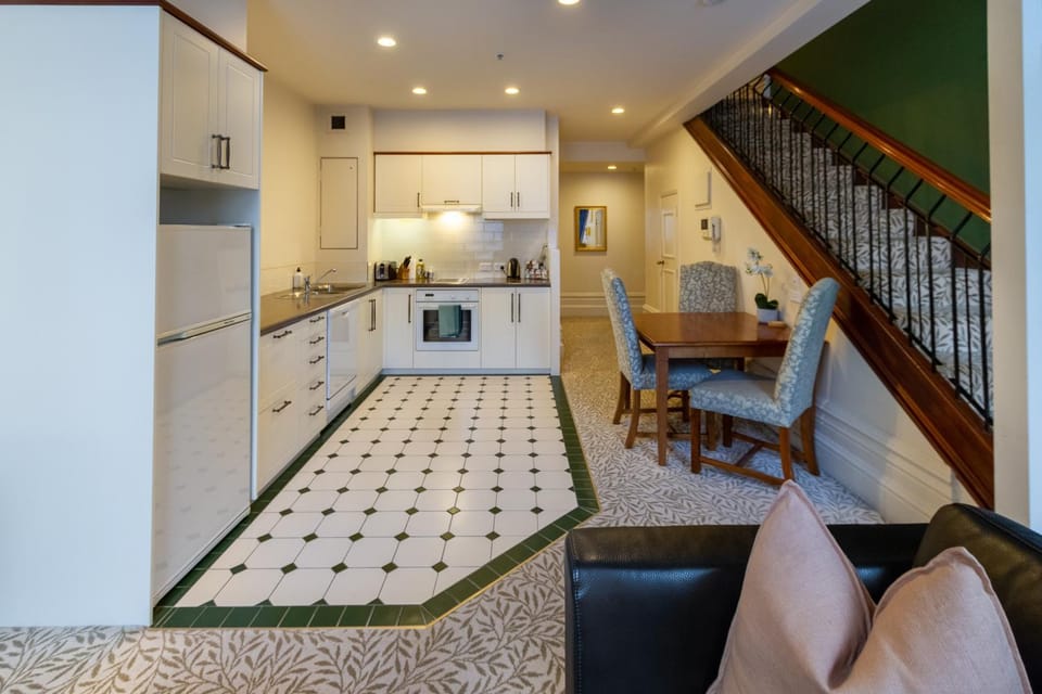 Kitchen or kitchenette, Living room, Decorative detail, Seating area, Dining area, dishwasher, furniture, oven, stove, kitchen