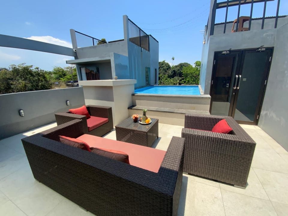 View (from property/room), Balcony/Terrace, Seating area, Swimming pool