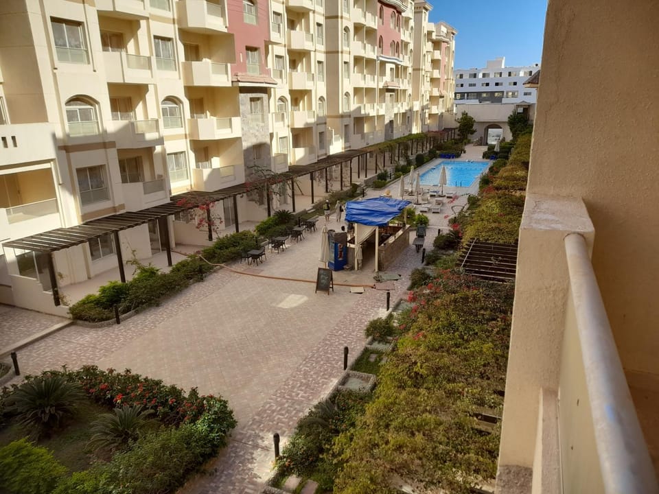 Property building, Patio, Neighbourhood, View (from property/room), Balcony/Terrace, Pool view, Swimming pool, Location