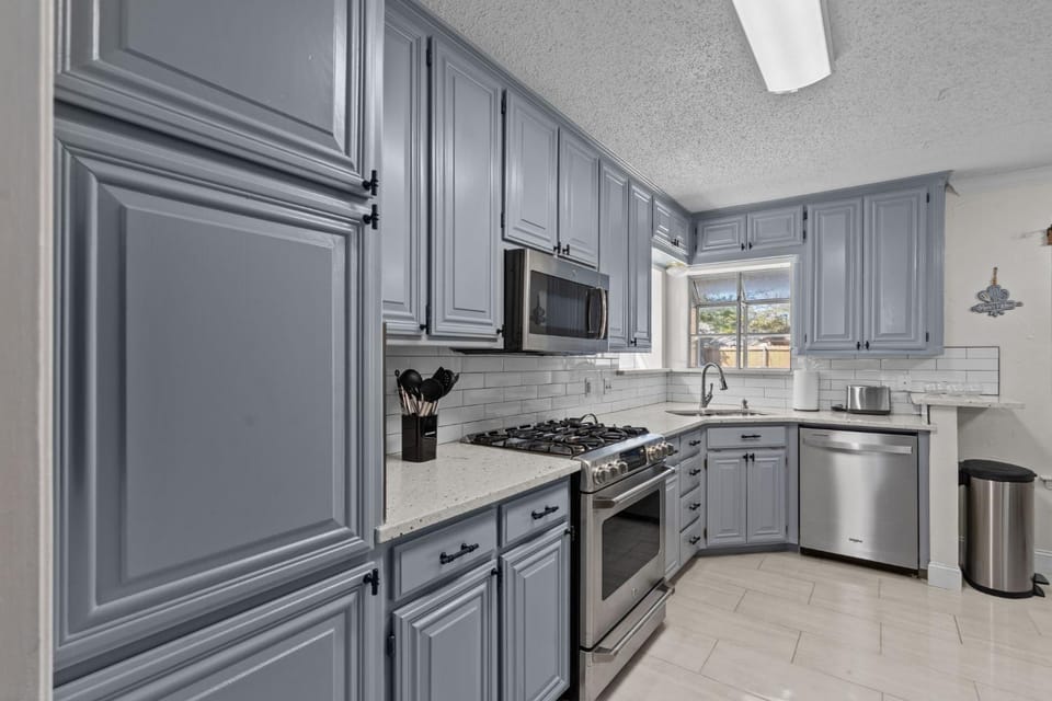 Kitchen or kitchenette, dishwasher, oven, stove, toaster