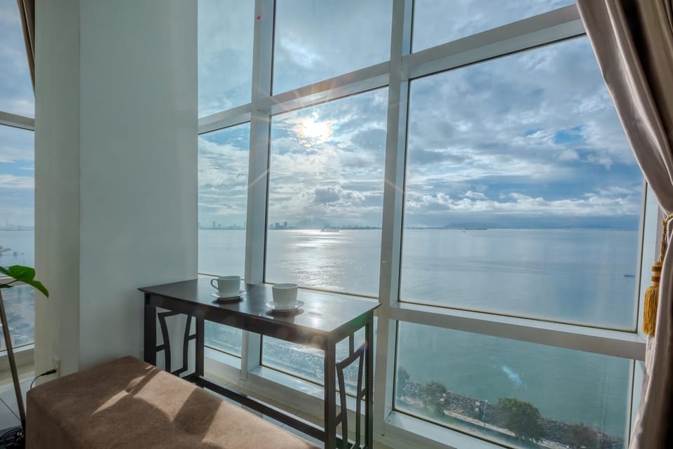 Natural landscape, View (from property/room), Living room, Seating area, Sea view