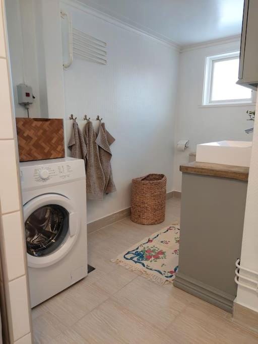 Toilet, towels, washing machine