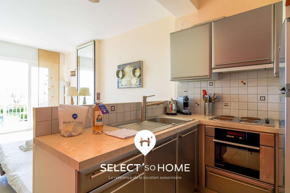 Kitchen or kitchenette, dishwasher, oven, stove, toaster