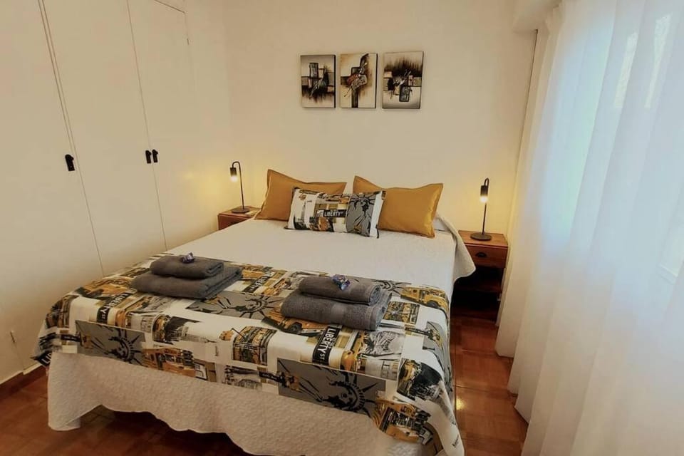 Bed, towels, wardrobe