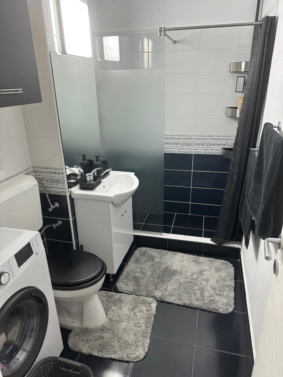 Shower, Toilet, Bathroom, towels, washing machine, dryer