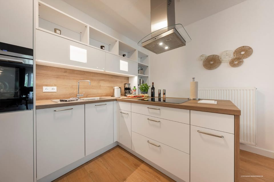 Kitchen or kitchenette, dishwasher, oven, stove