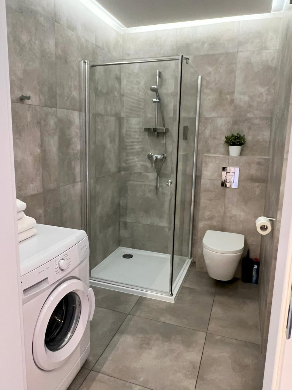 Shower, Toilet, Bathroom, towels, washing machine, dryer