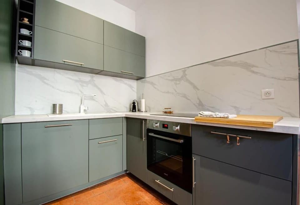 Kitchen or kitchenette, dishwasher, oven, stove