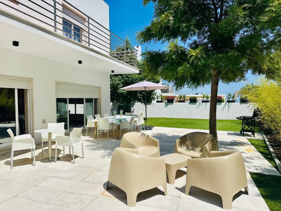 Property building, Patio, Day, Natural landscape, Garden, View (from property/room), Balcony/Terrace, Seating area, Garden view, Sea view, sunbed