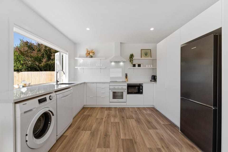 Kitchen or kitchenette, dishwasher, oven, stove, washing machine