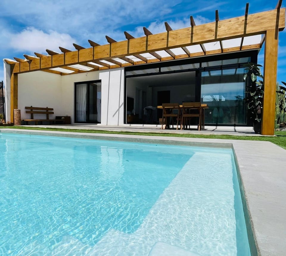Property building, Day, Pool view, Swimming pool, sunbed