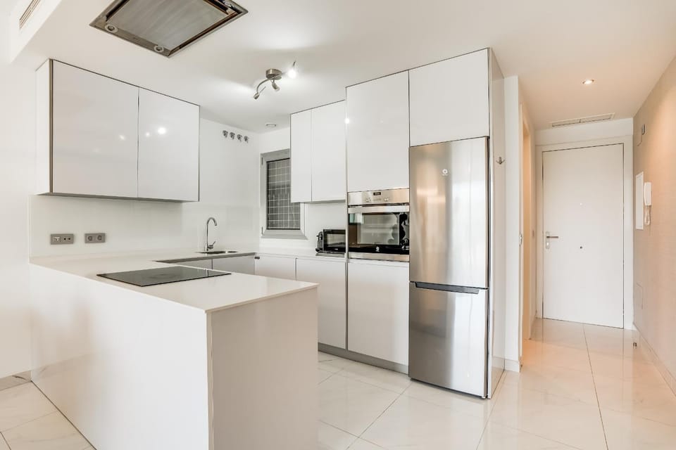 Kitchen or kitchenette, dishwasher, oven, stove, toaster