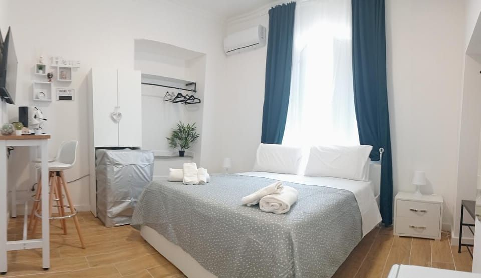 Bed, Photo of the whole room, Bedroom, towels, air conditioner